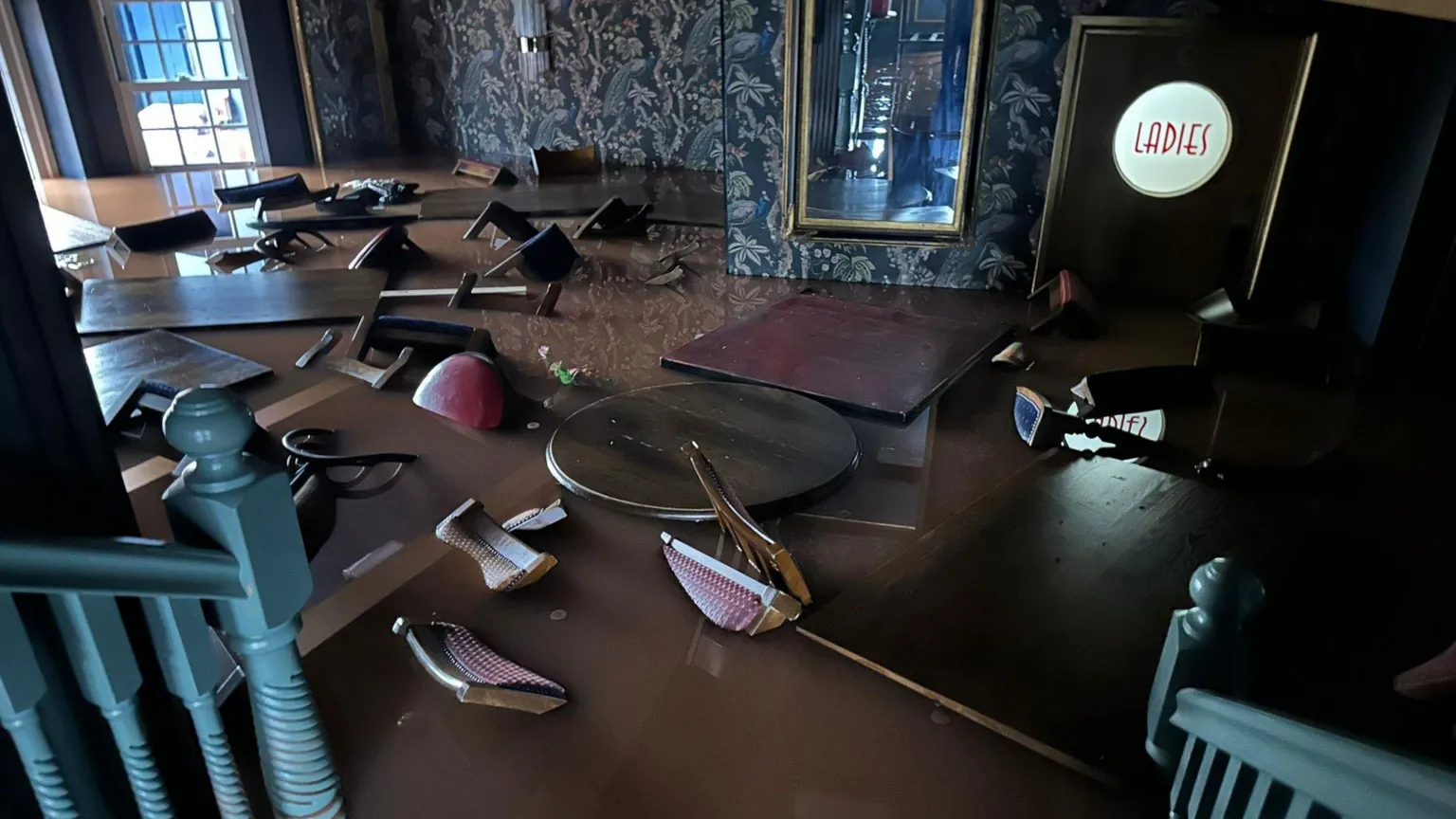 Andrea Shull Picture of Shull's restaurant in brown water, tables and chairs underwater 