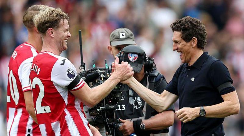 Nathan Collins and Keith Andrews high-five each other