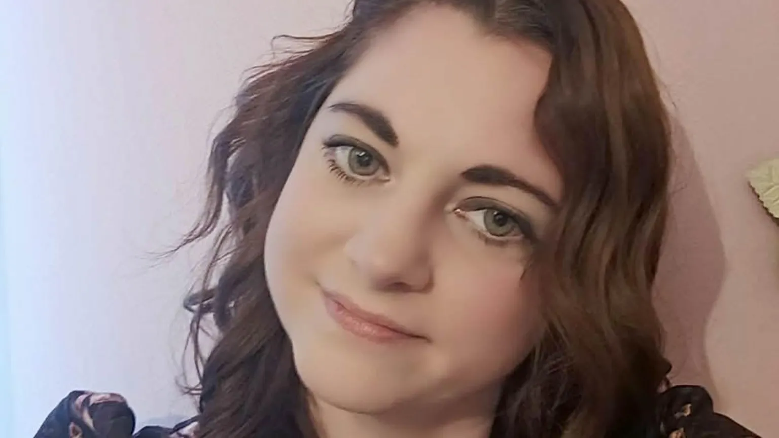 Camilla Ridd Camilla Ridd has curly brown hair and has slanted her head slightly to the right for this picture, which she offers a slight smile in.