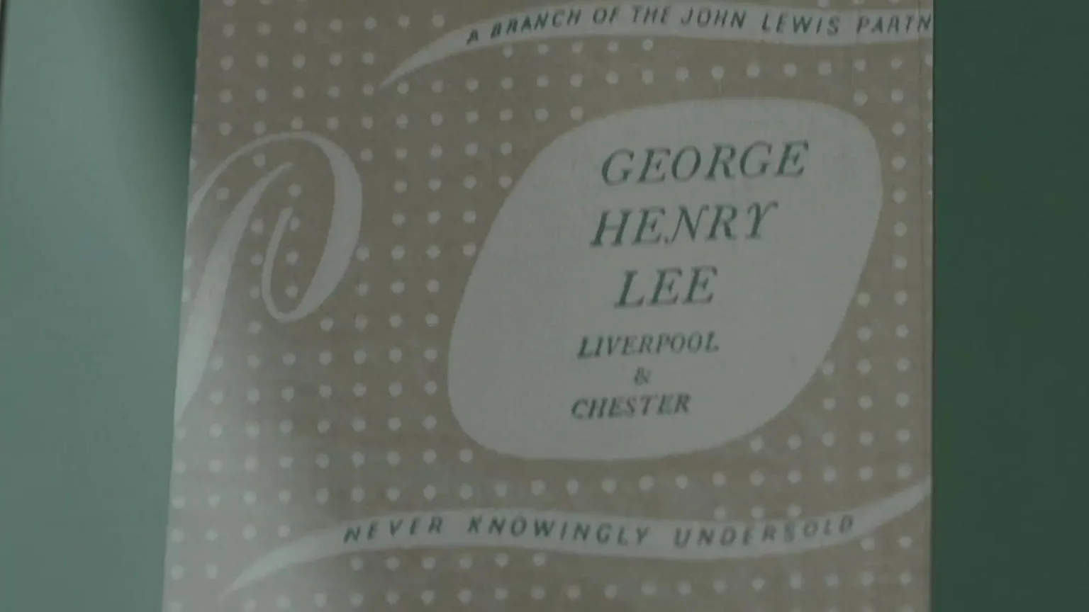 A paper bag bearing the words 'George Henry Lee - Liverpool & Chester'