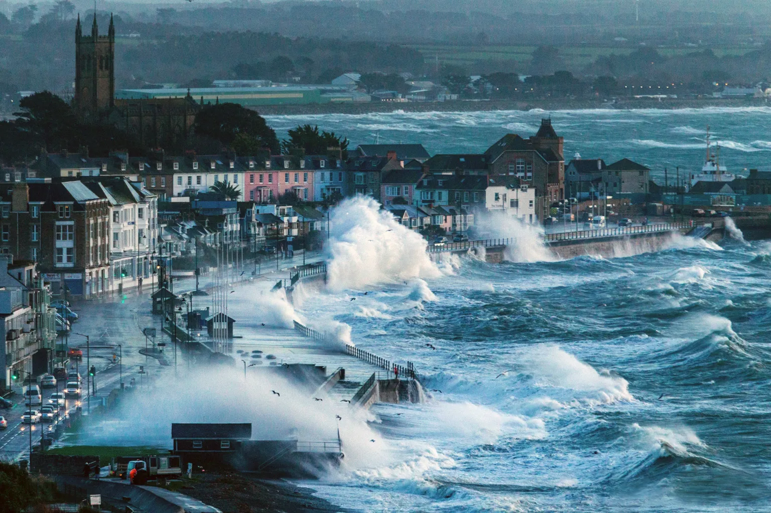 Cornish-Seascapes.com Large waves in a stormy sea batter the Promenade lined by houses in the coastal Cornish town of Penzance.