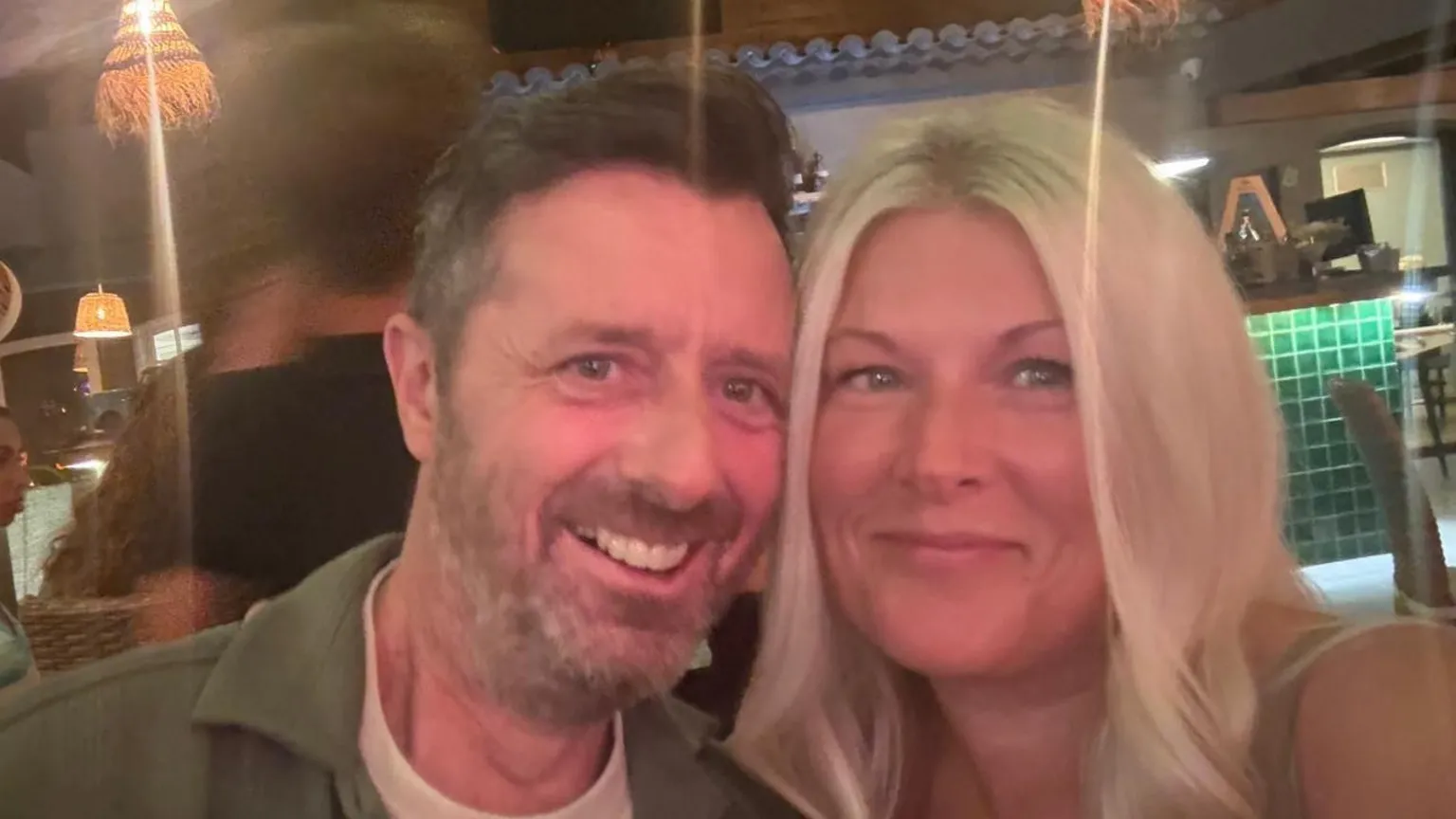 Jason and Hayley Bowen Jason Bowen, wearing a green shirt and with short brown hair and a short beard, smiles with his wife Hayley who has long blonde hair