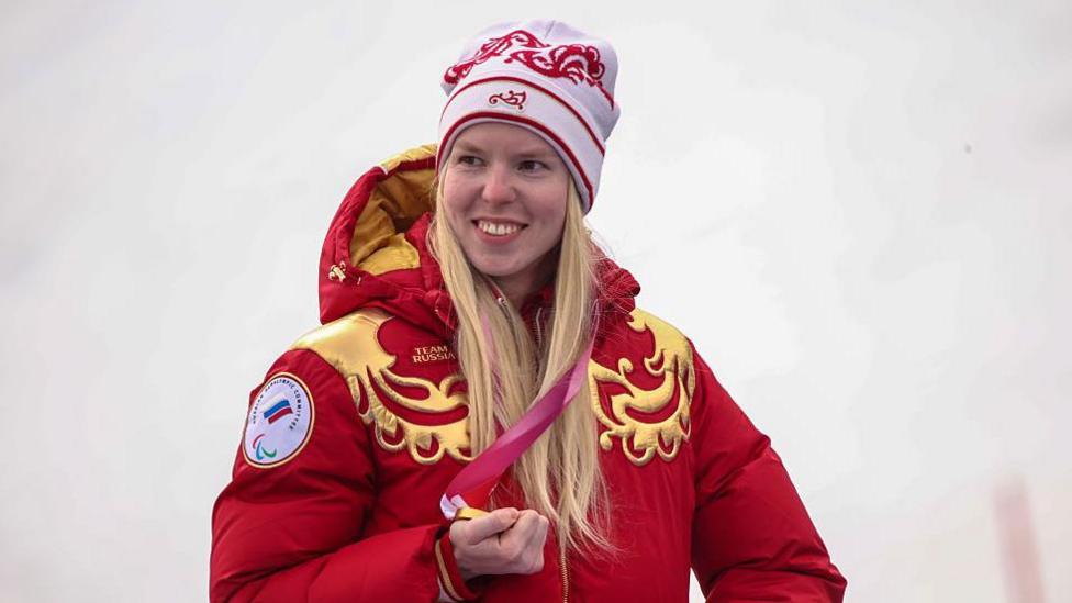 Varvara Voronchikhina on the Super G medal podium