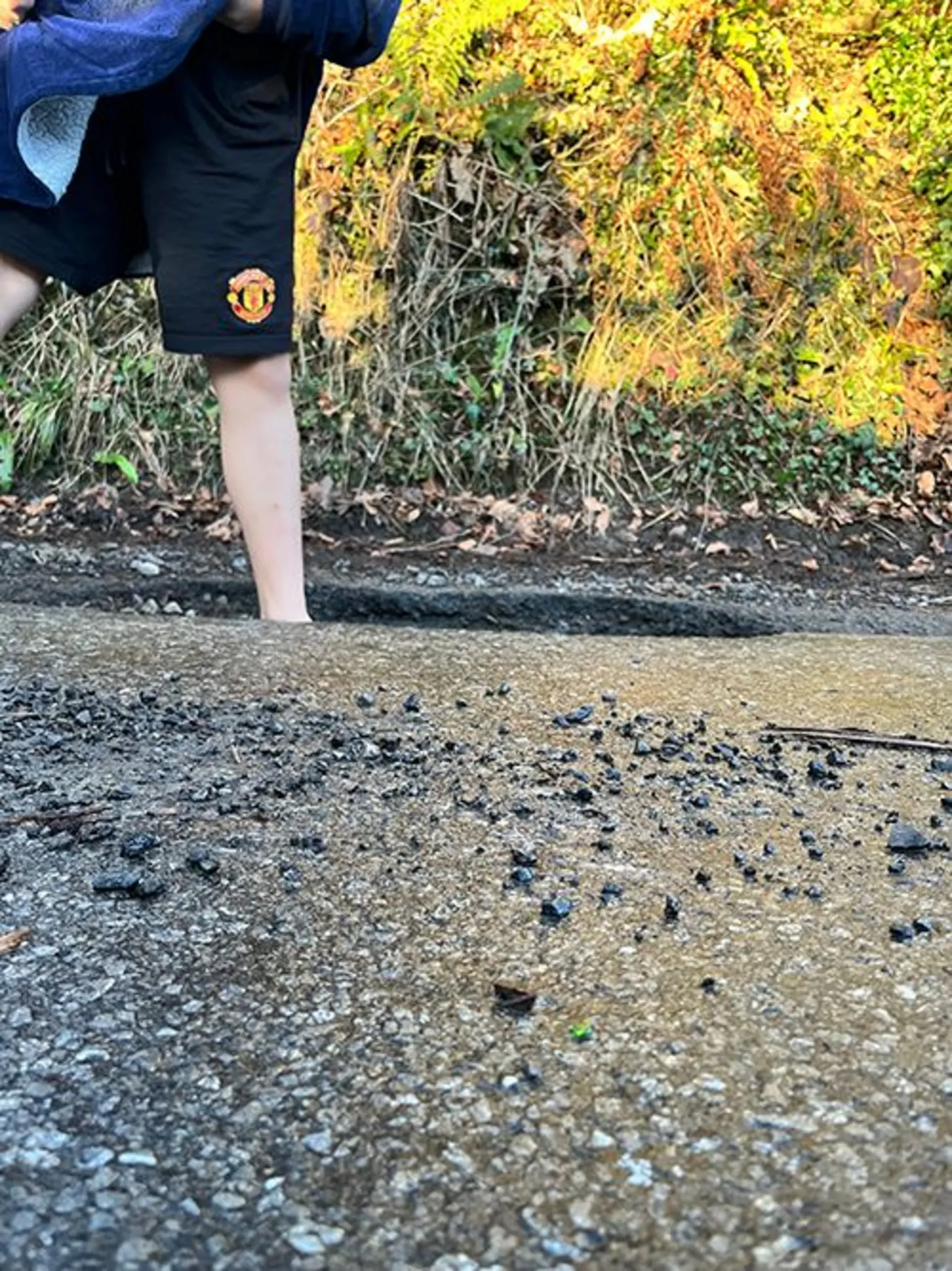 Sion Dafydd Sion Dafydd is standing in the pothole that damaged his car. You can not see below his ankle as it is so deep.