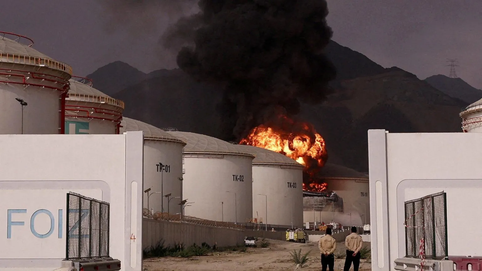 Fire and smoke rise in the Fujairah oil industry zone, caused by debris after interception of a drone by air defenses, on 4 March
