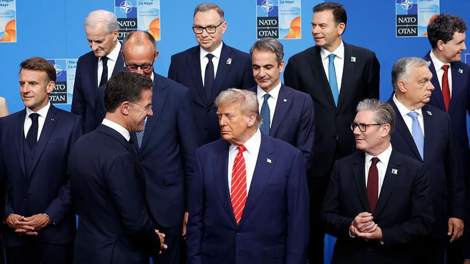  Trump stands alongside Nato allies at a Nato event. 