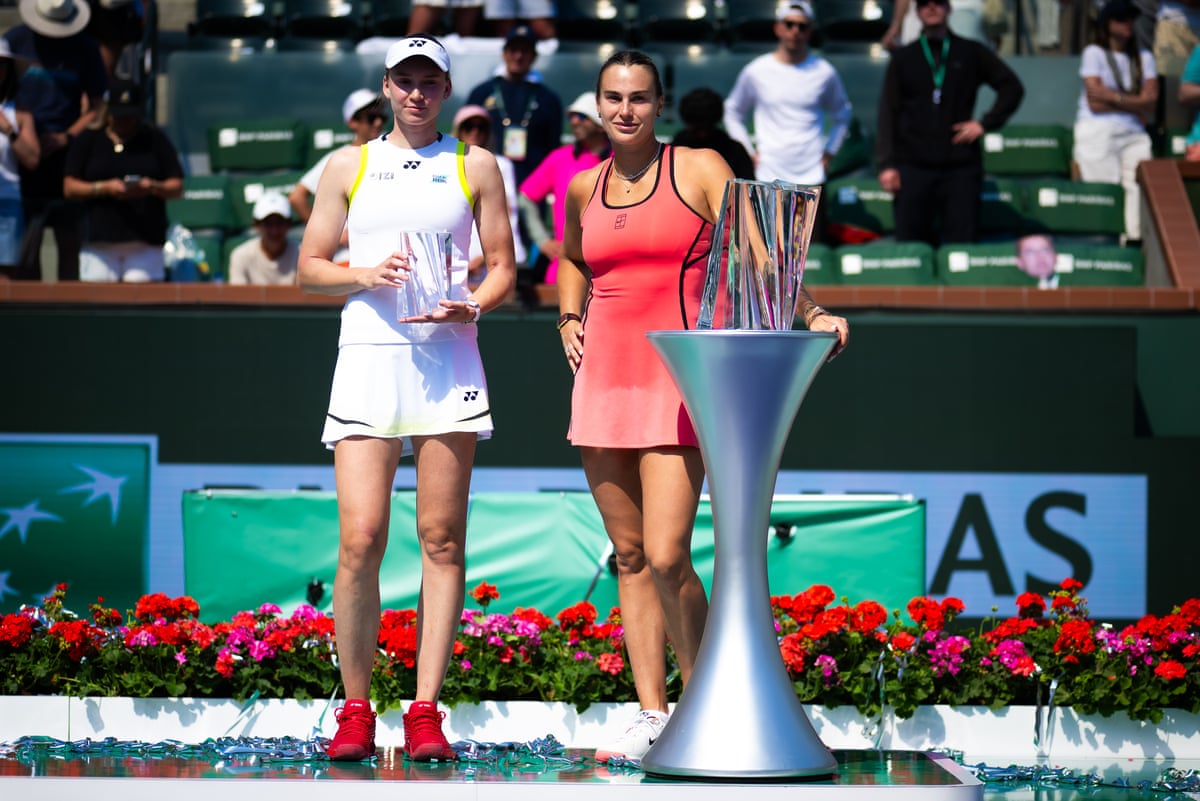 Elena Rybakina (left) and Aryna Sabalenka posing for a photo with their trophies