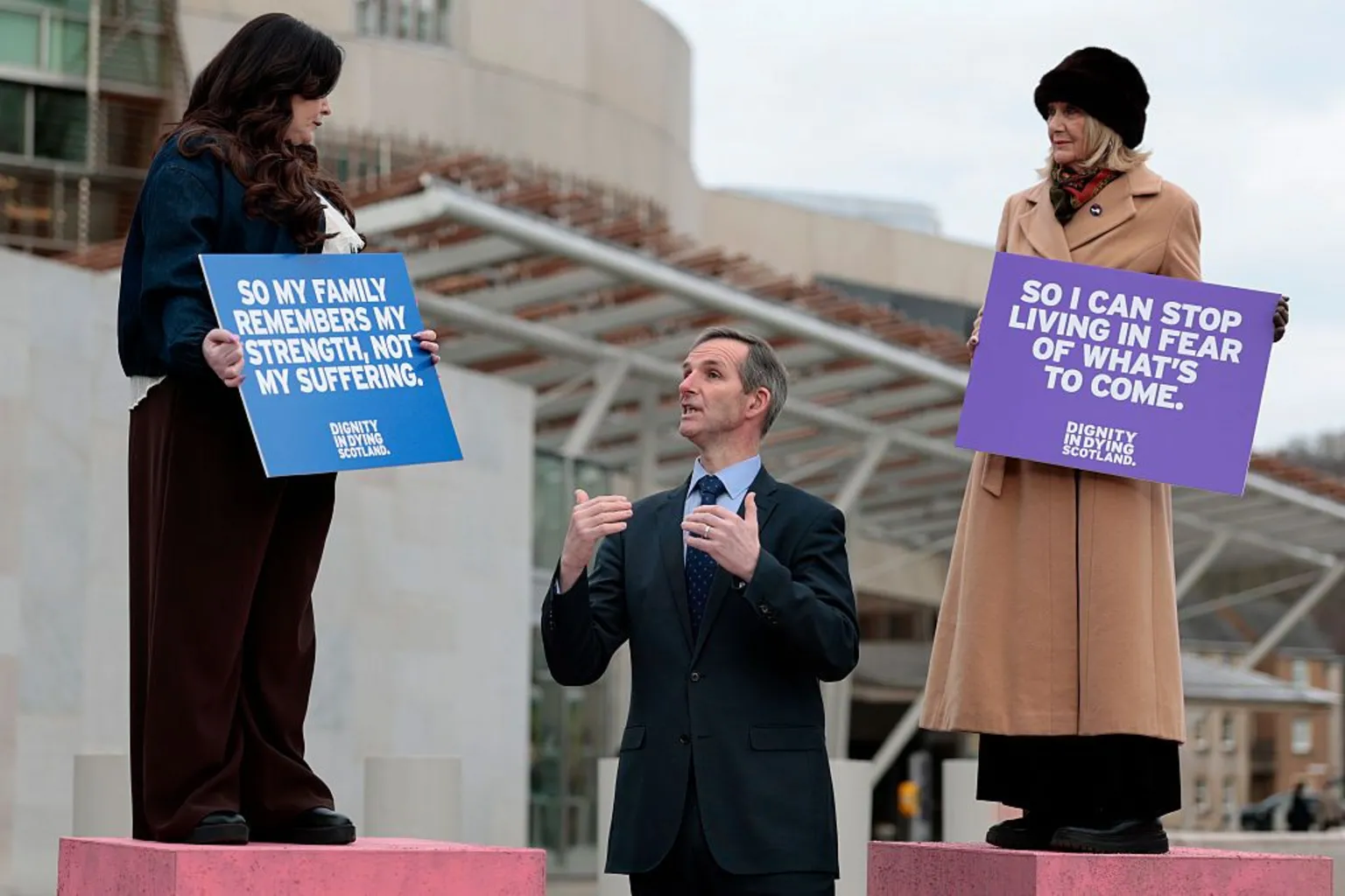 Terminally ill women Lisa Fleming, Tish McEwan and Liam McArthur MSP attend a photocall outside the Scottish Parliament in favour of the assisted dying bill in Scotland