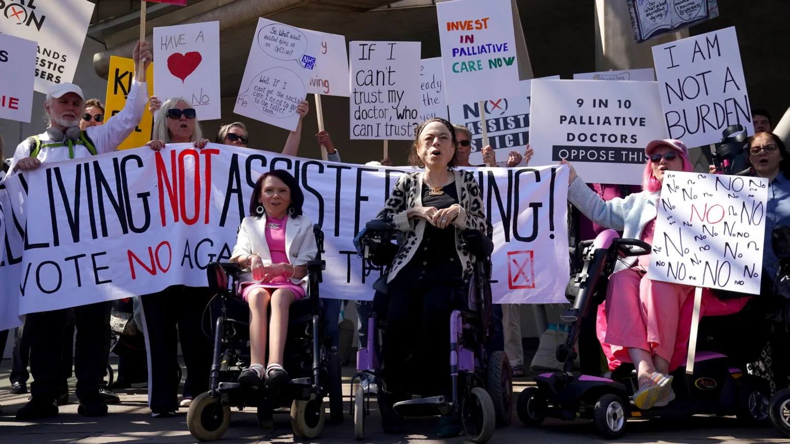  Actress Liz Carr (right) and Pam Duncan-Glancy MSP with members of the Glasgow Disability Alliance, demonstrating outside the Scottish Parliament in Edinburgh, ahead of the debate and vote on the Assisted Dying for Terminally Ill Adults (Scotland) Bill
