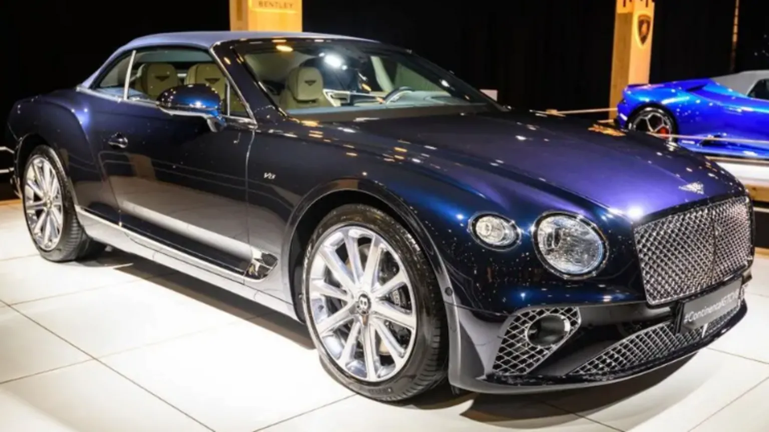  A navy Bentley car on show at an event