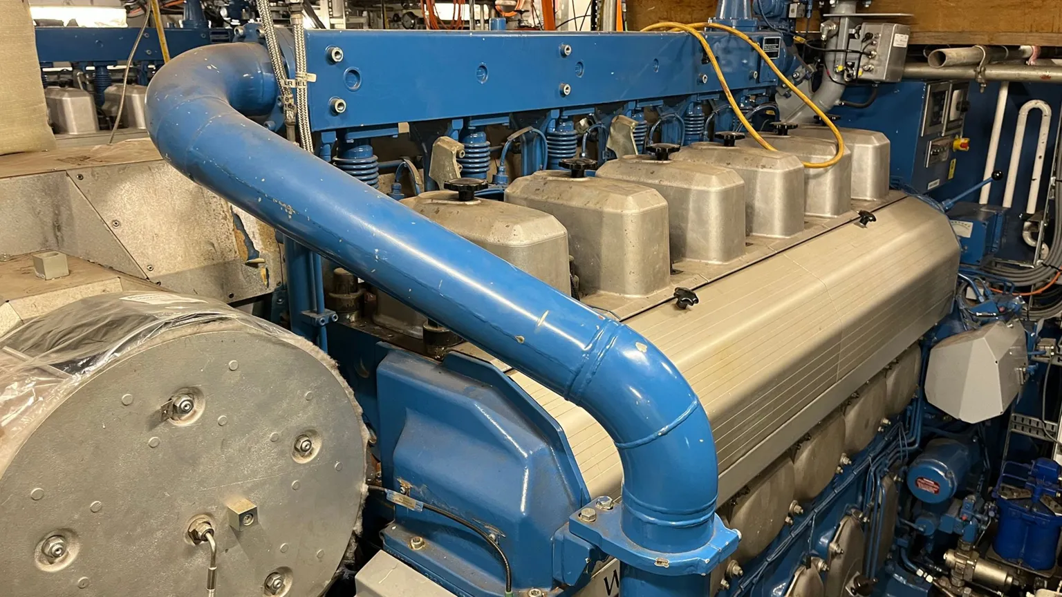 A large silver and blue marine engine