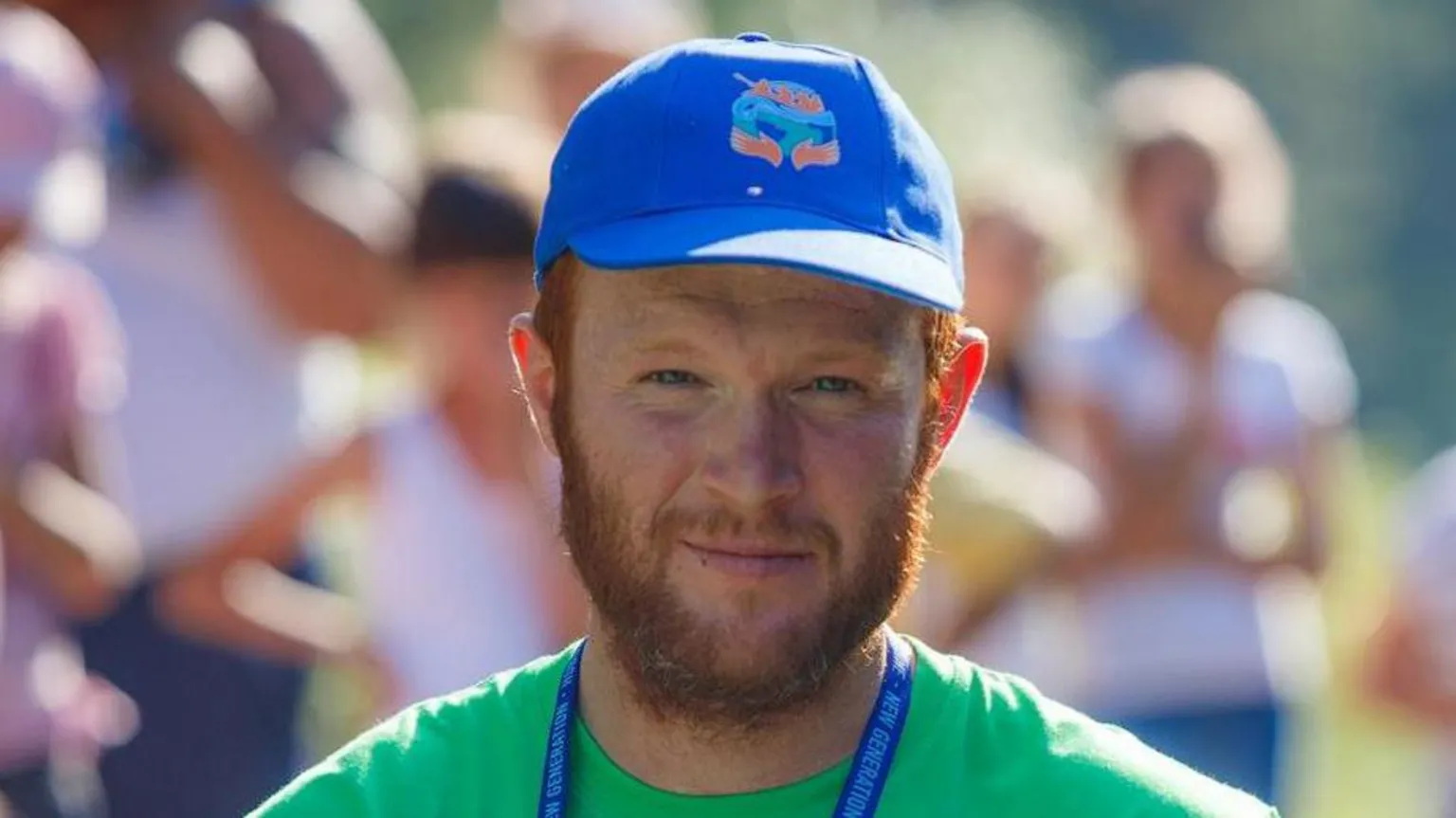 Central Scotland News Agency A photo of Ruaridh Stevenson, a man with red hair and a red beard, wearing a green T-shirt and a blue baseball cap, taken outside