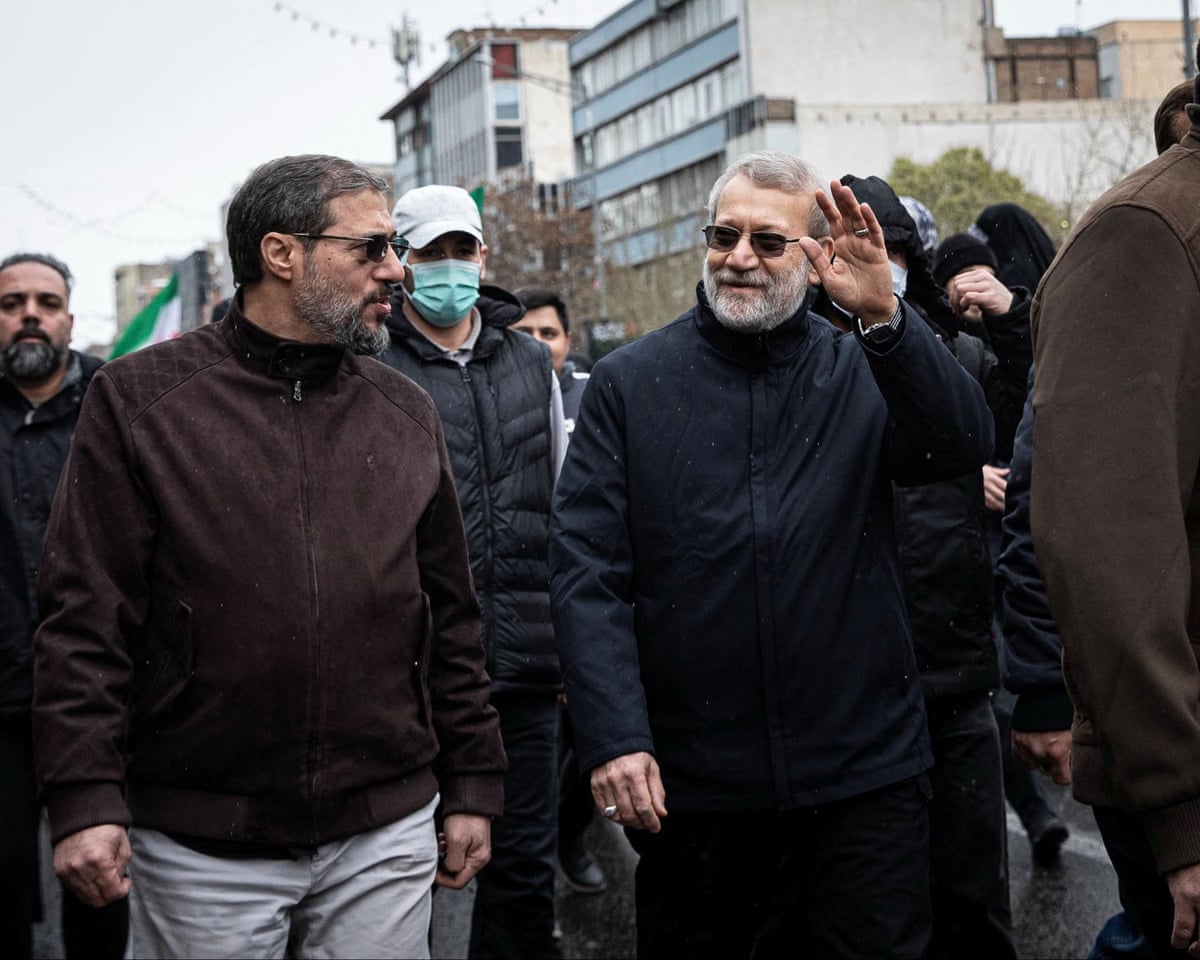 Ali Larijani takes part in a rally in Tehran on 13 March