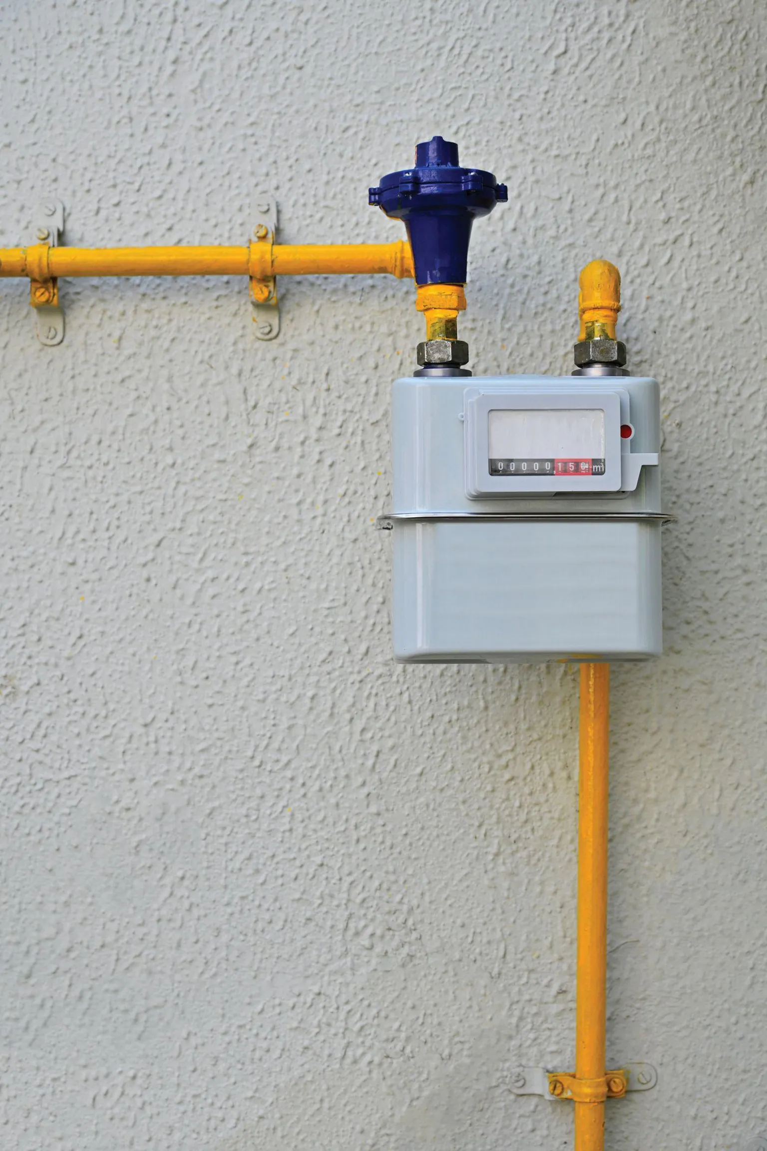  PNG gas meter on house kitchen wall - stock photo
