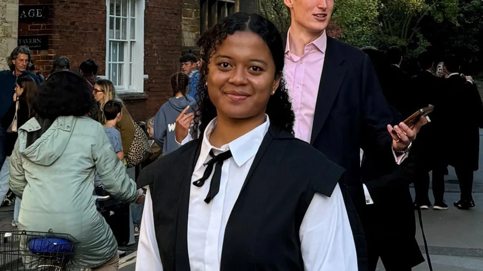 Victoria Tassongo Victoria pictured wearing smart clothes and smiling at the camera