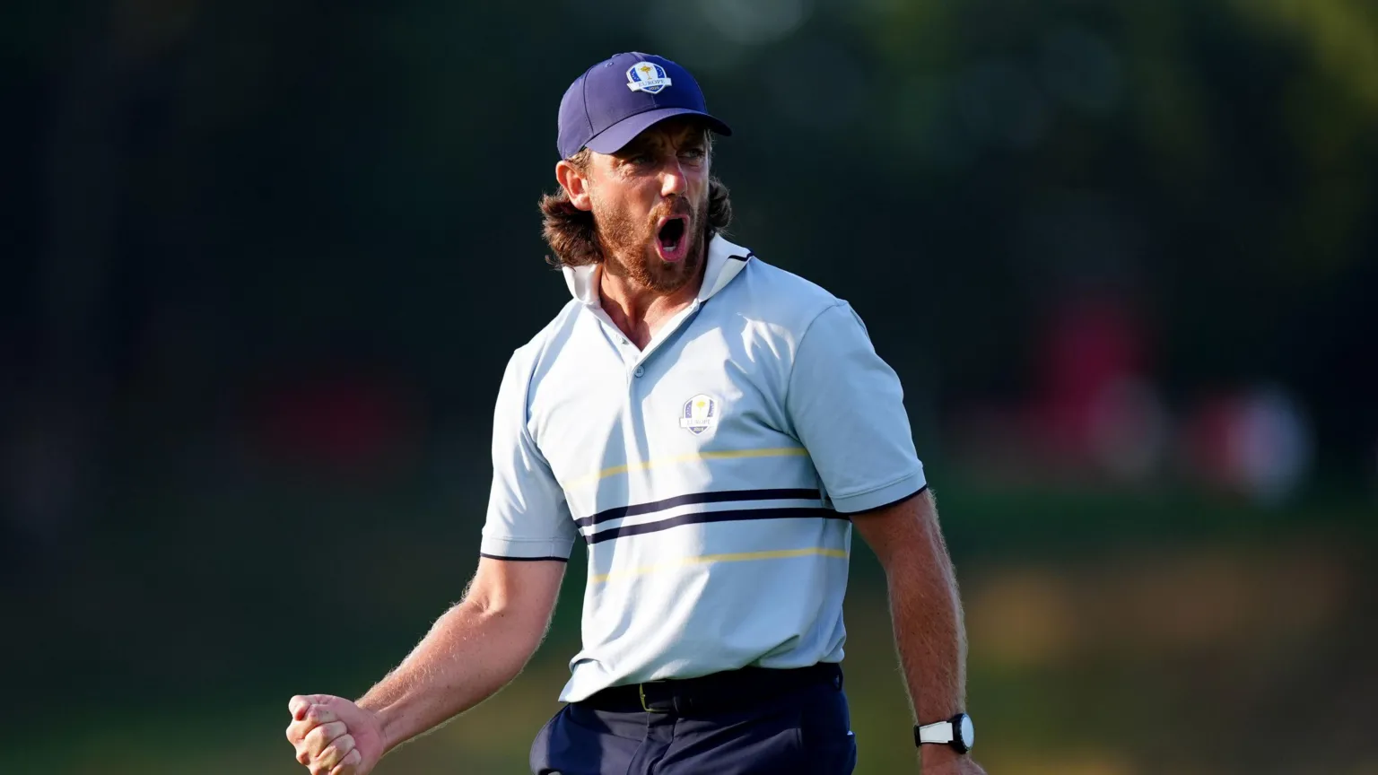  Tommy Fleetwood of Team Europe gives a fist pump reacts following a putt on 16 on day one of the 2025 Ryder Cup at the Bethpage Black Course, Farmingdale, New York. He is wearing a Team Europe Ryder Cup navy baseball cap pale blue and navy and top. 