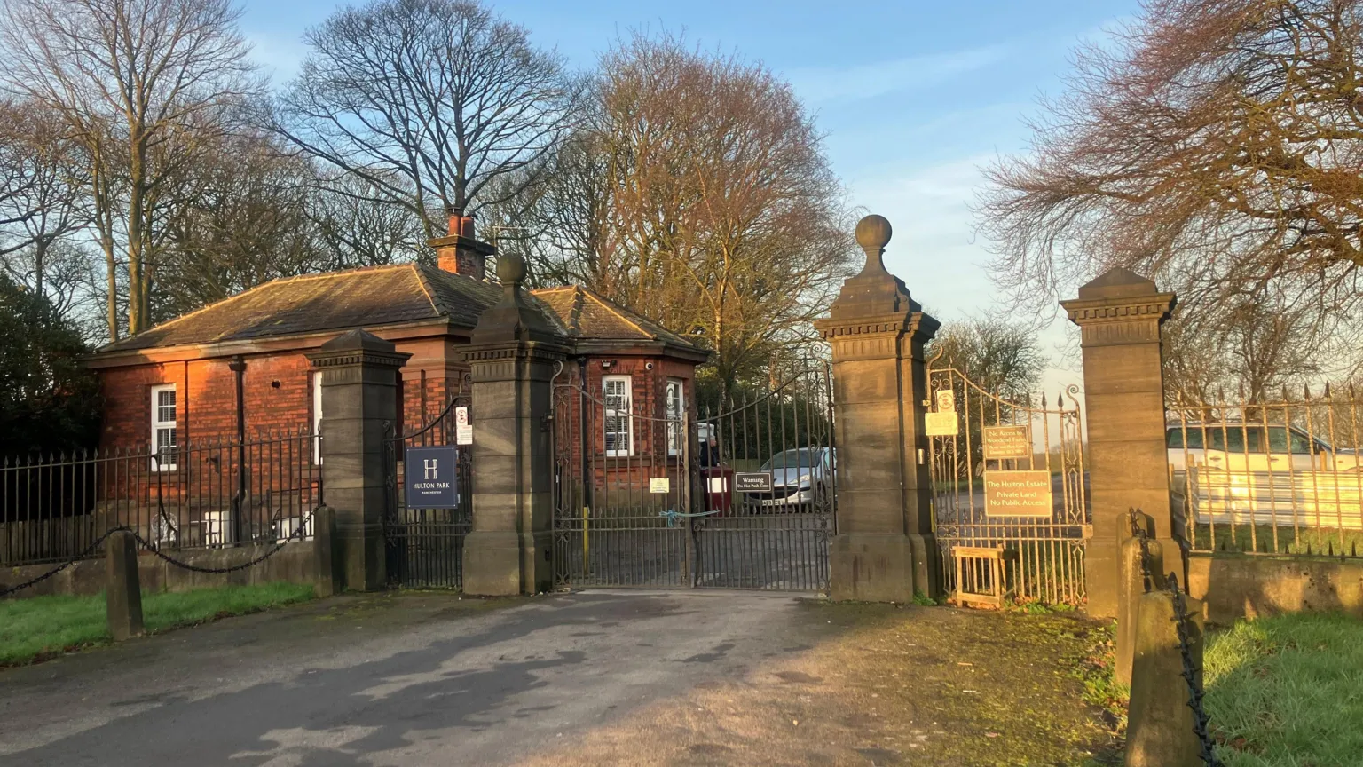 The entrance to the historic Hulton Park grounds. It shows the gates into the estate closed.