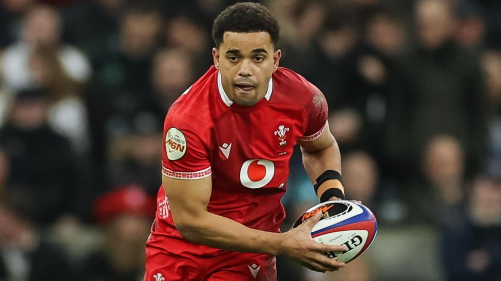 Ben Thomas carries the ball for Wales