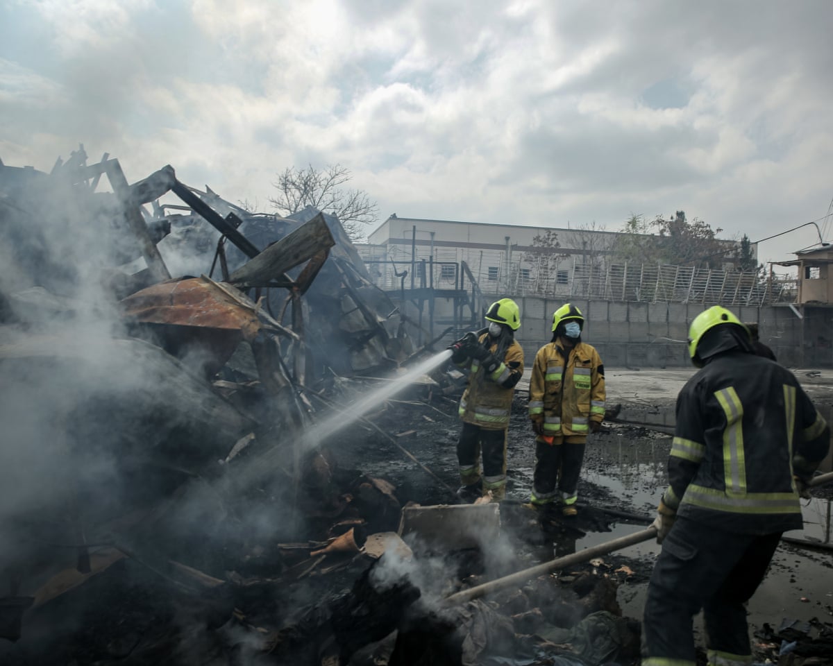 Firefighers work at the scene of Pakistani airstrikes in Kabul, Afghanistan, 17 March 2026.