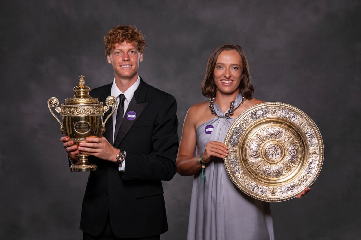 Jannik Sinner and Iga Swiatek with their trophies for winning Wimbledon singles in 2025