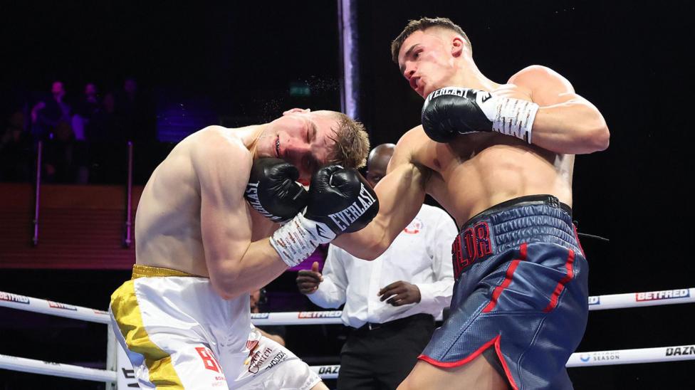 Taylor Bevan lands an uppercut on Szymon Kajda