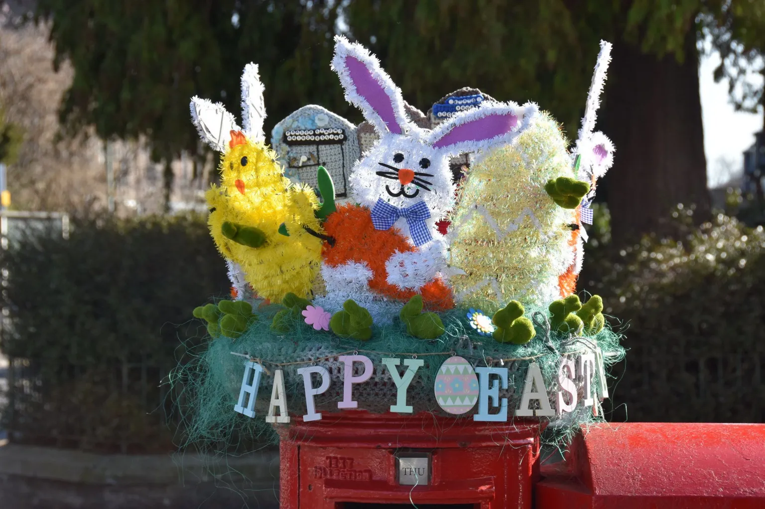 Duncan Murdoch A red postbox decorated with animal figures and the words Happy Easter
