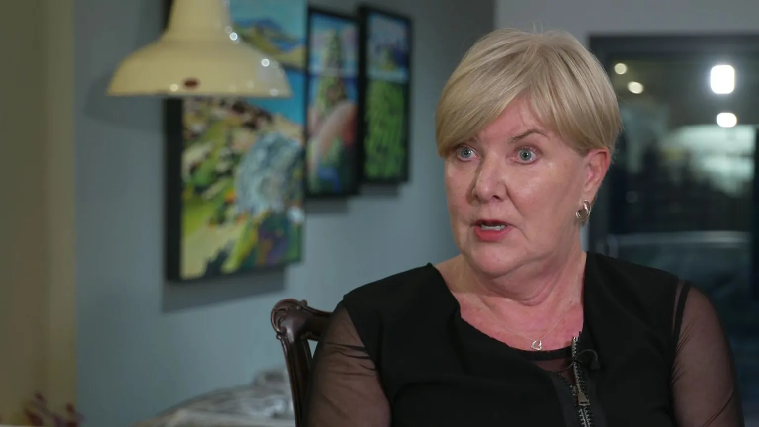 Pauline Shepherd. She has short blonde hair, wearing a black blouse and small gold hoop earrings.