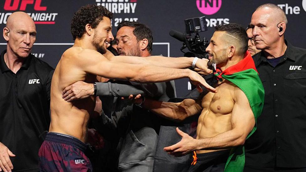 Shem Rock shoves Abdul-Kareem Al-Selwady during their face-off