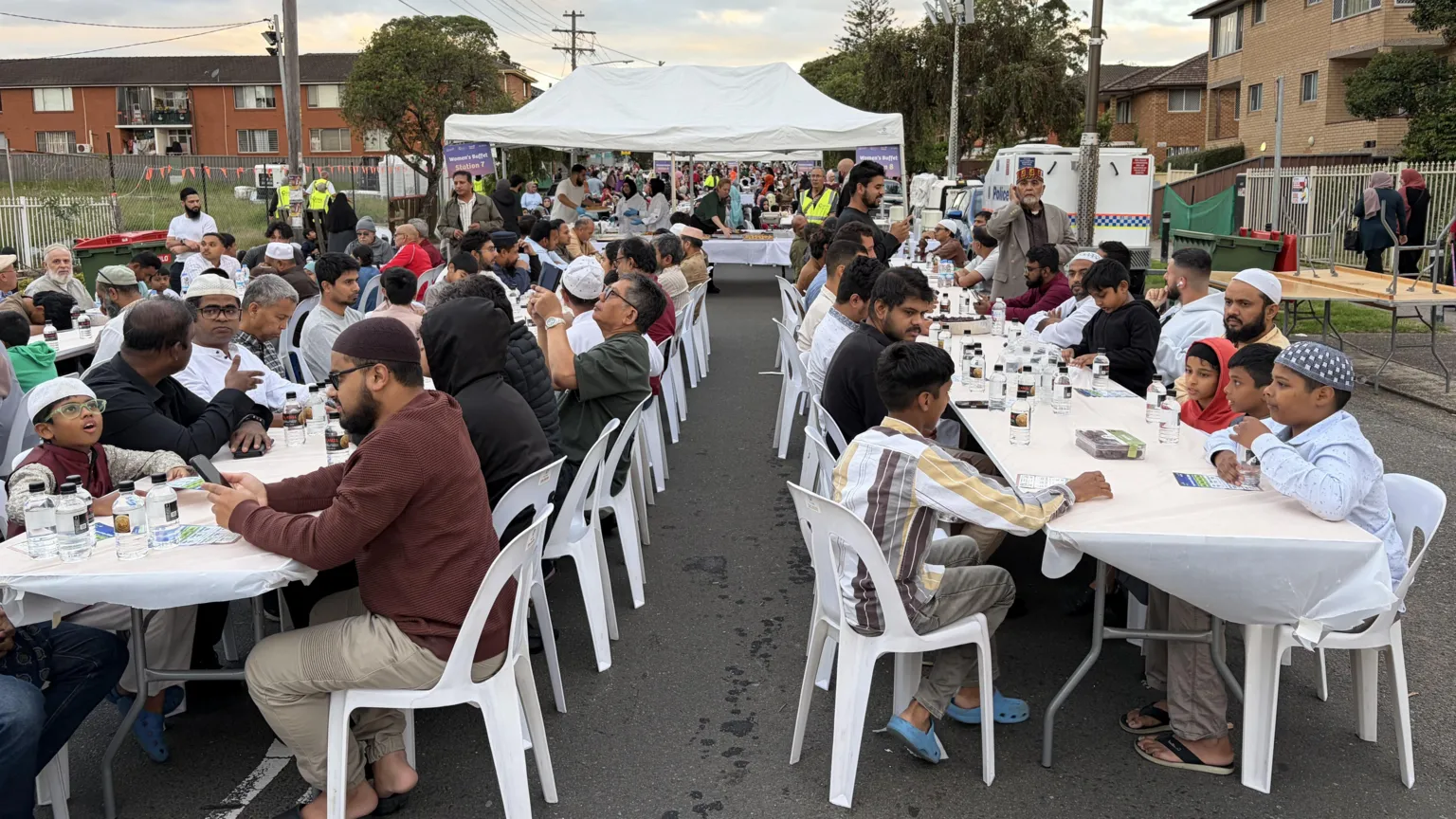 People gather for a community iftar at the Imam Ali bin Abi Taleb Mosque