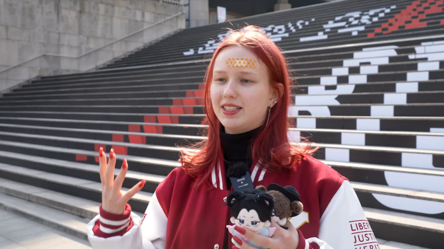 BBC/Jungmin Choi Ami Ostrovskaia standing in the square.