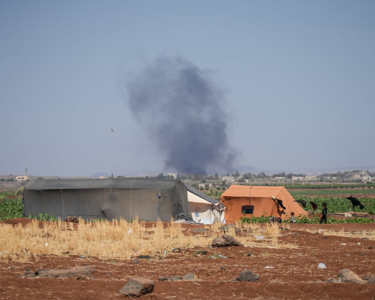 Smoke rises from fires in areas controlled by Druze factions in Syria’s Sweida countryside in July last year