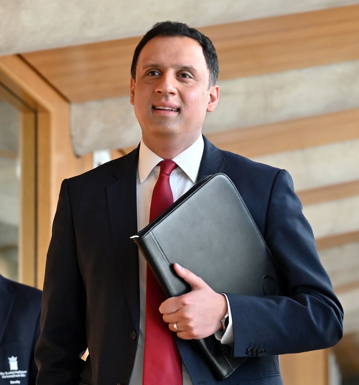 Anas Sarwar carrying a folder.