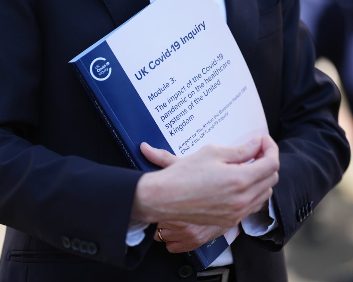 A person holds a copy of the Covid-19 Inquiry’s latest report, which sets out how the NHS ‘teetered on the brink’.