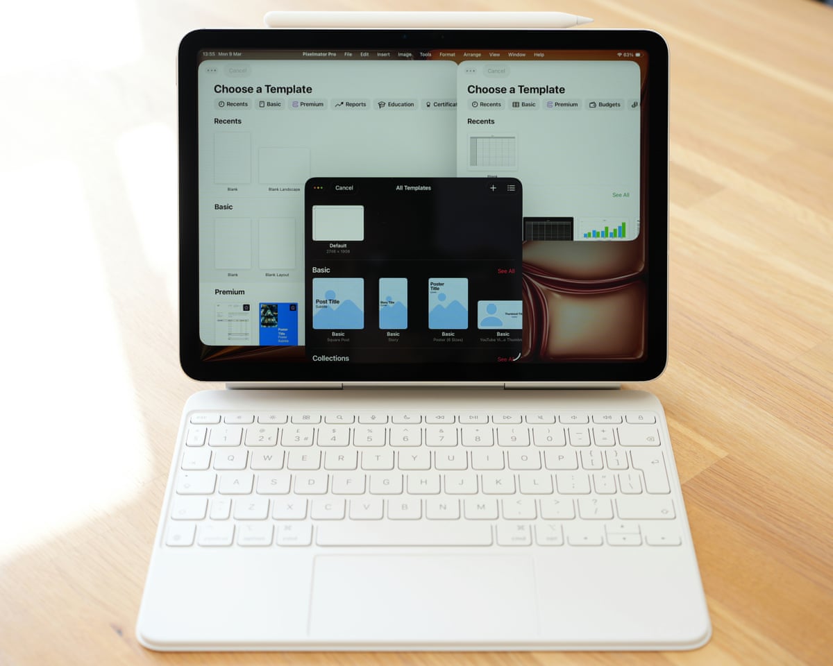 Apple iPad Air M4 in the Magic Keyboard case showing multiple windows open on the desktop.