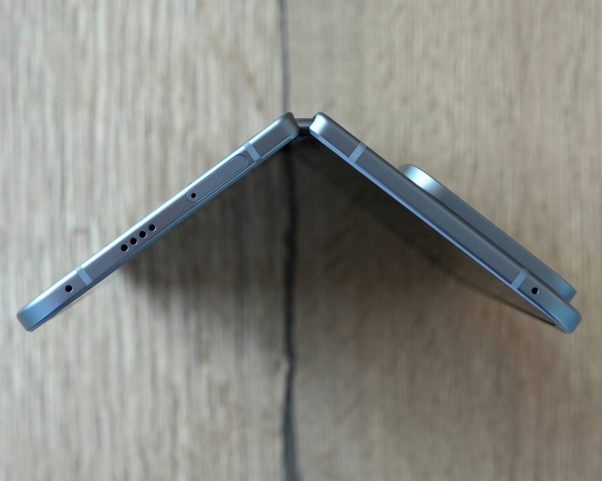The Google Pixel 10 Pro Fold partly open stood up on a table showing the top of the hinge.