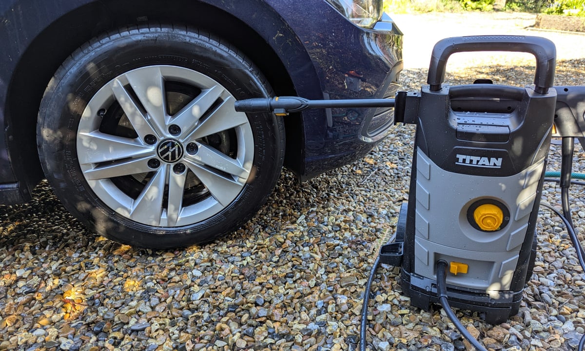 The Titan TTB1800PRW pressure washer sitting next to a car tyre it has just cleaned