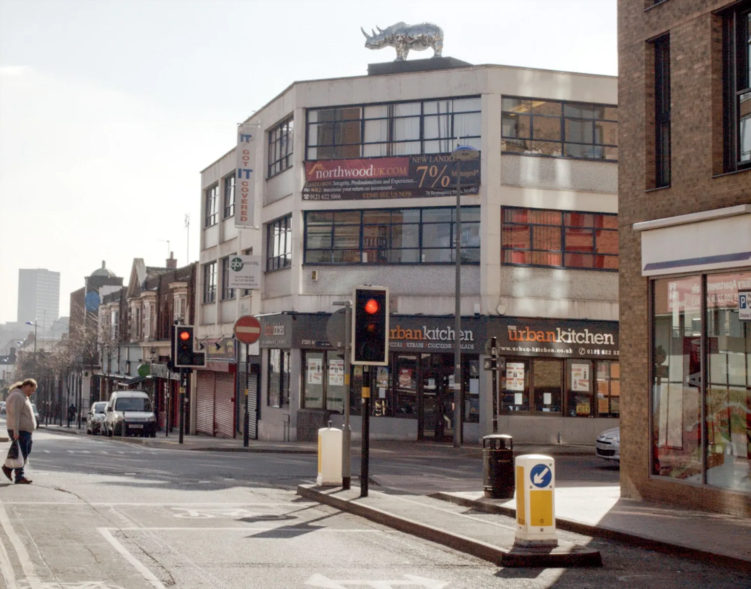 habiloid A giant rhino on top of a building in Birmingham