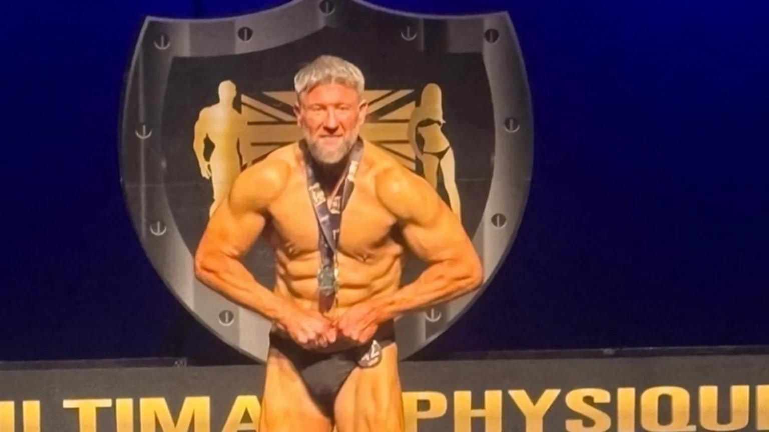 Clint Trayhern The image is split into two sections. On the left, a highly muscular individual is standing on a stage under bright lighting, performing a bodybuilding pose. On the right, a close‑up scene shows an individual drinking from a clear glass containing raw eggs.