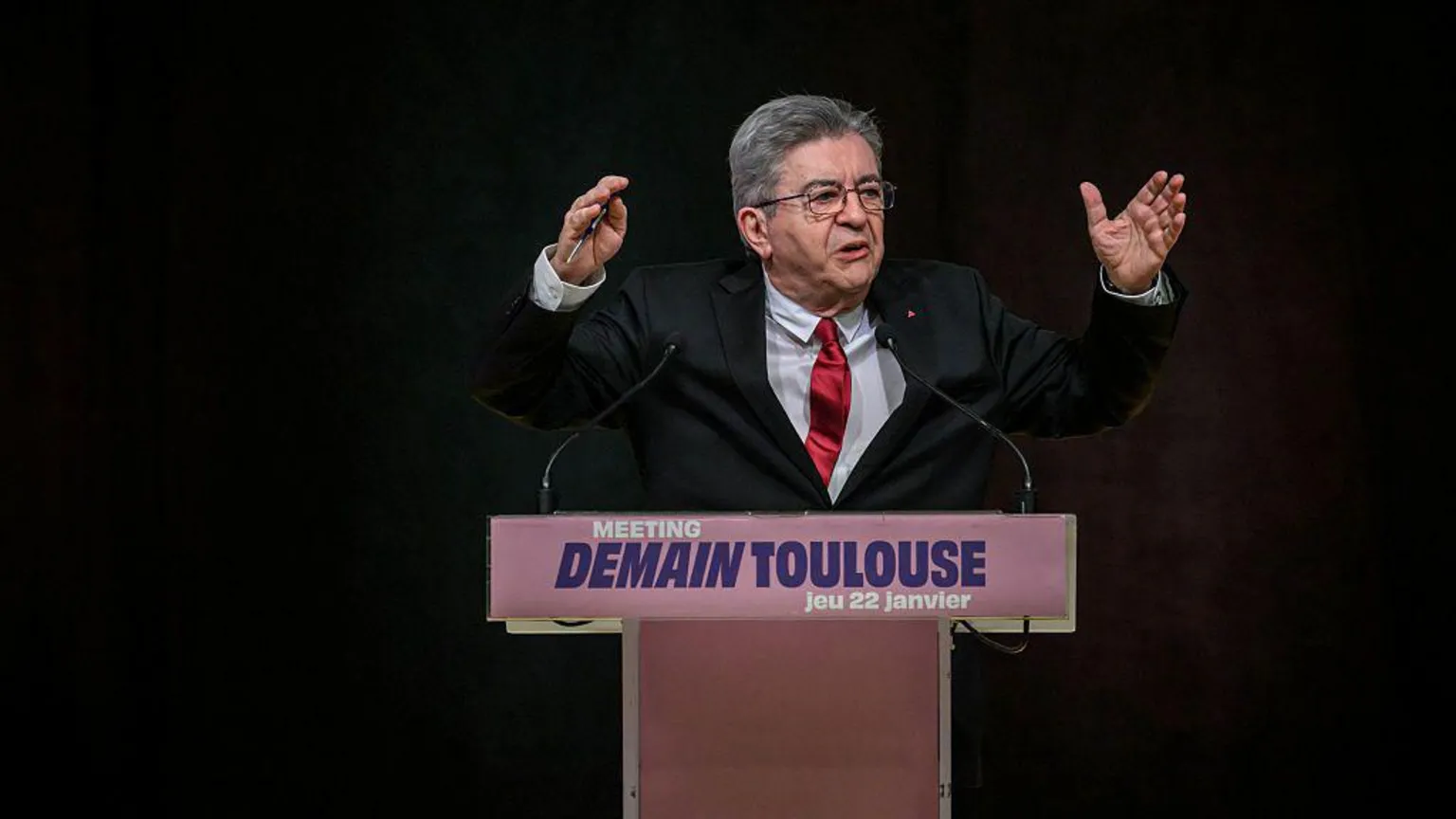 Leader of far-left party, La France Insoumise Jean-Luc Mélenchon before a podium reading