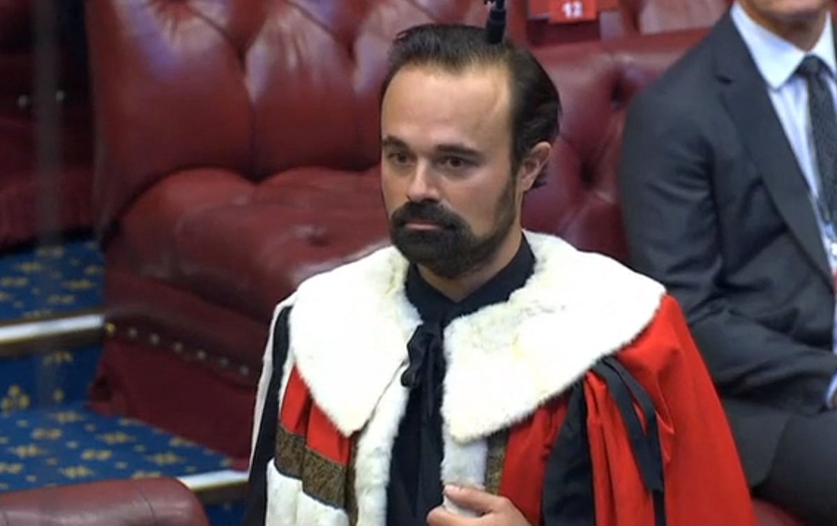Evgeny Lebedev in the House of Lords: he is wearing a ceremonial red robe with white fur collar and has short black hair and a beard.