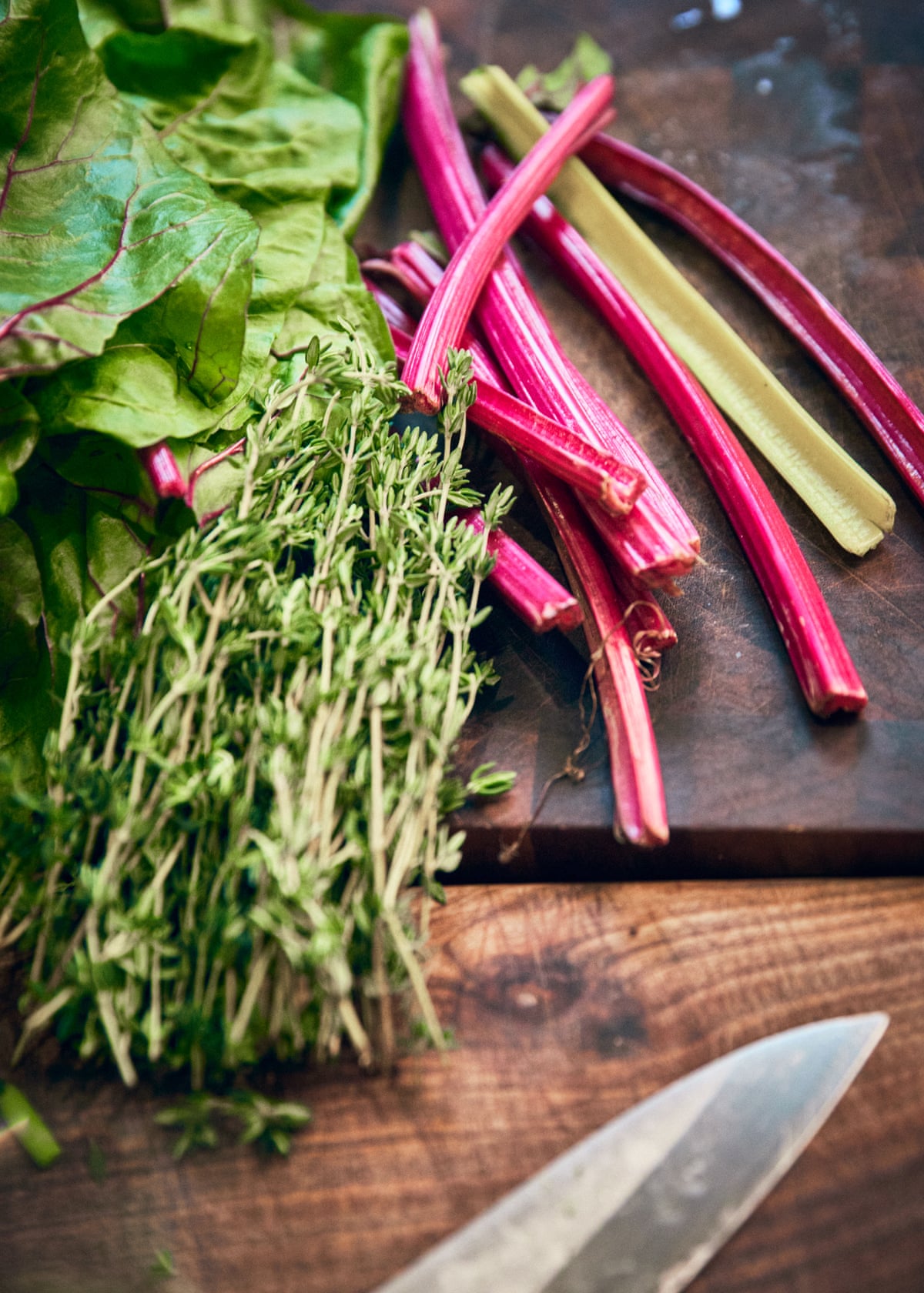 Vegetables and herbs on a copping board