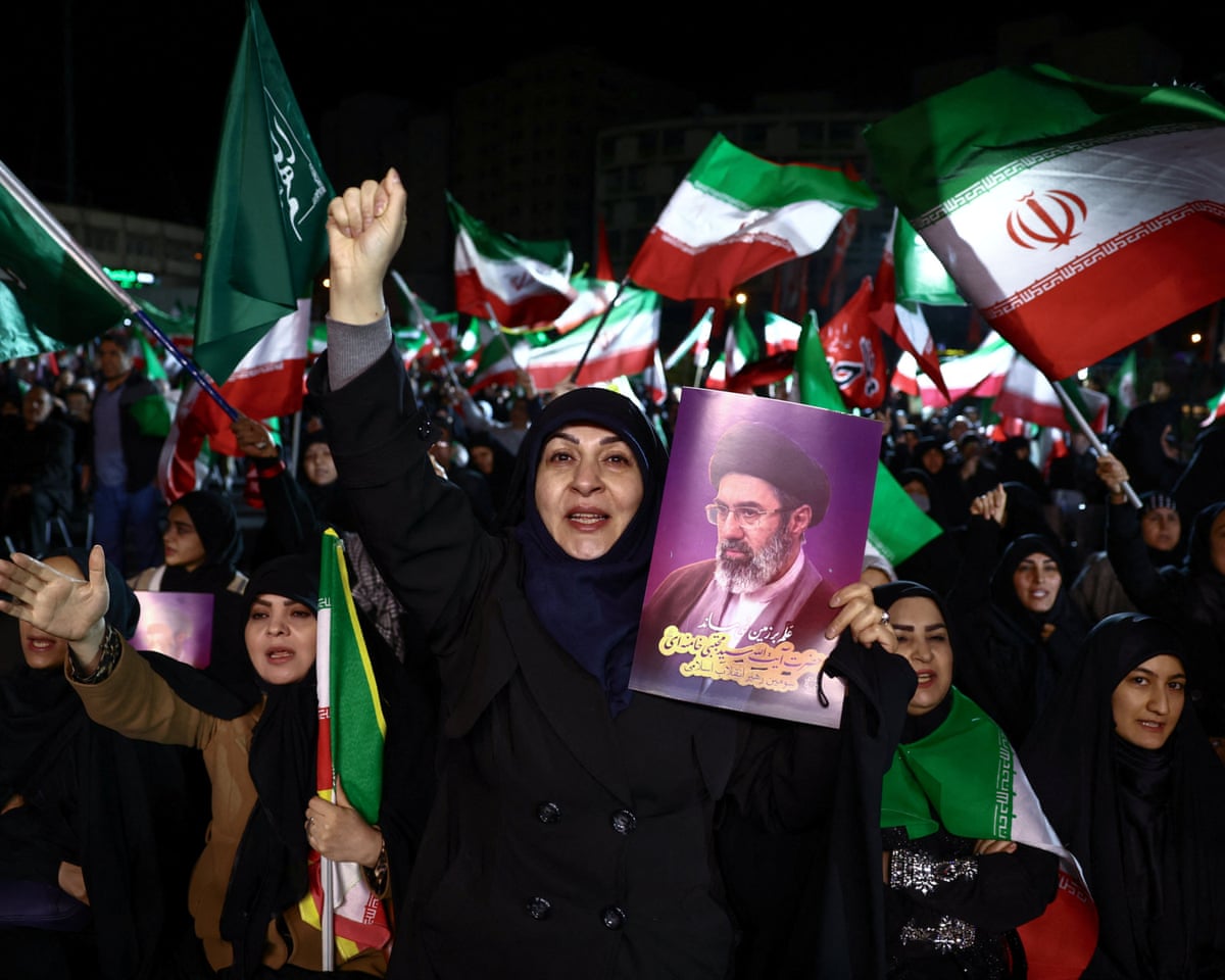 People attend an anti-US and Israeli rally in Tehran, Iran, on Sunday