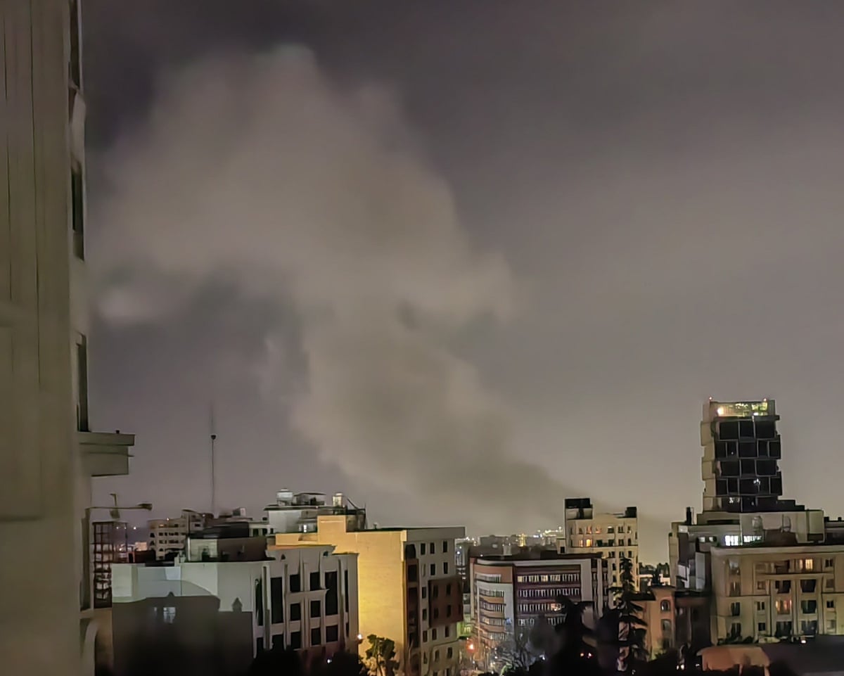 Smoke billows after explosions in Tehran on Monday