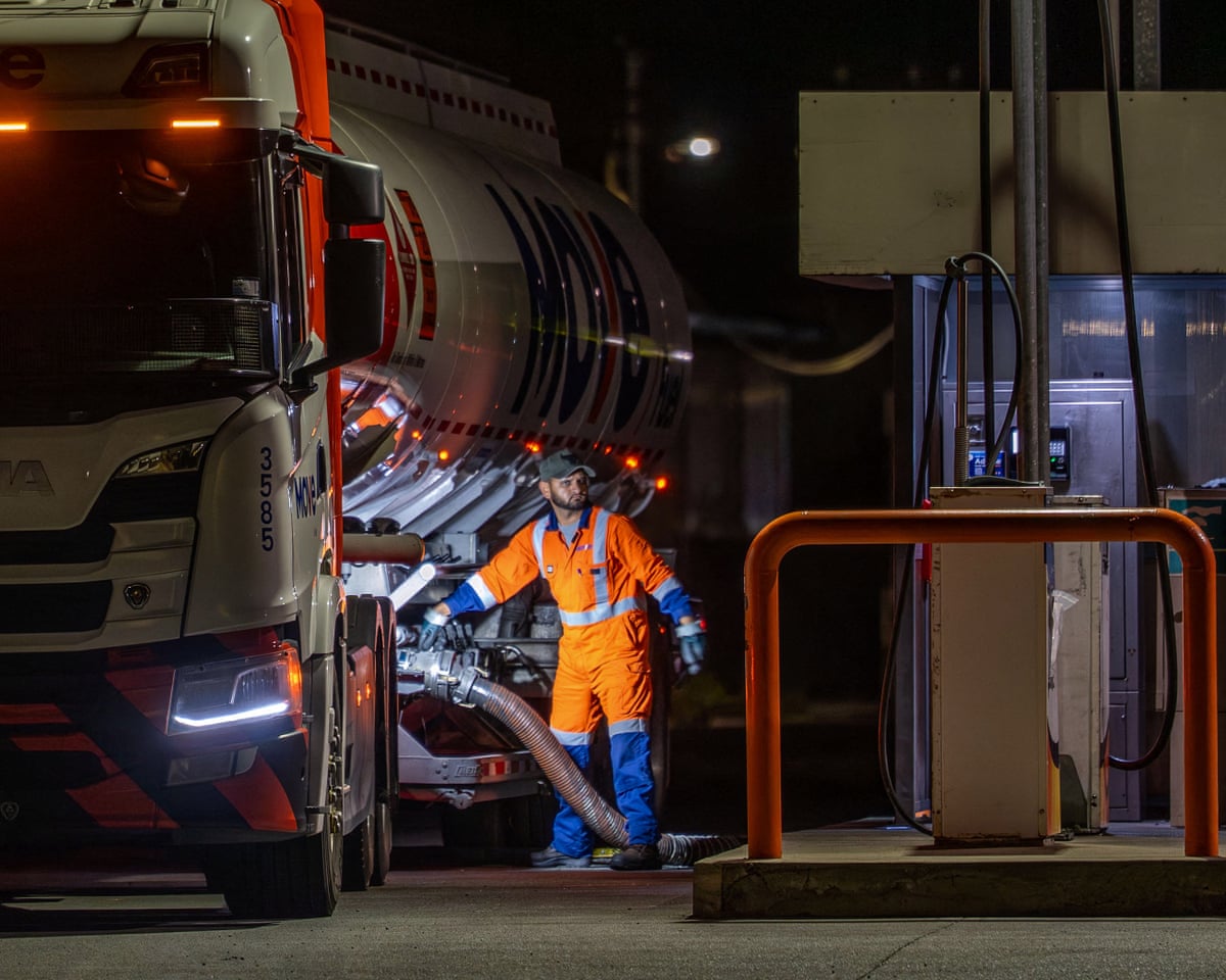 A fuel tanker driver fills the tanks of a petrol station in Wellington, New Zealand, last week