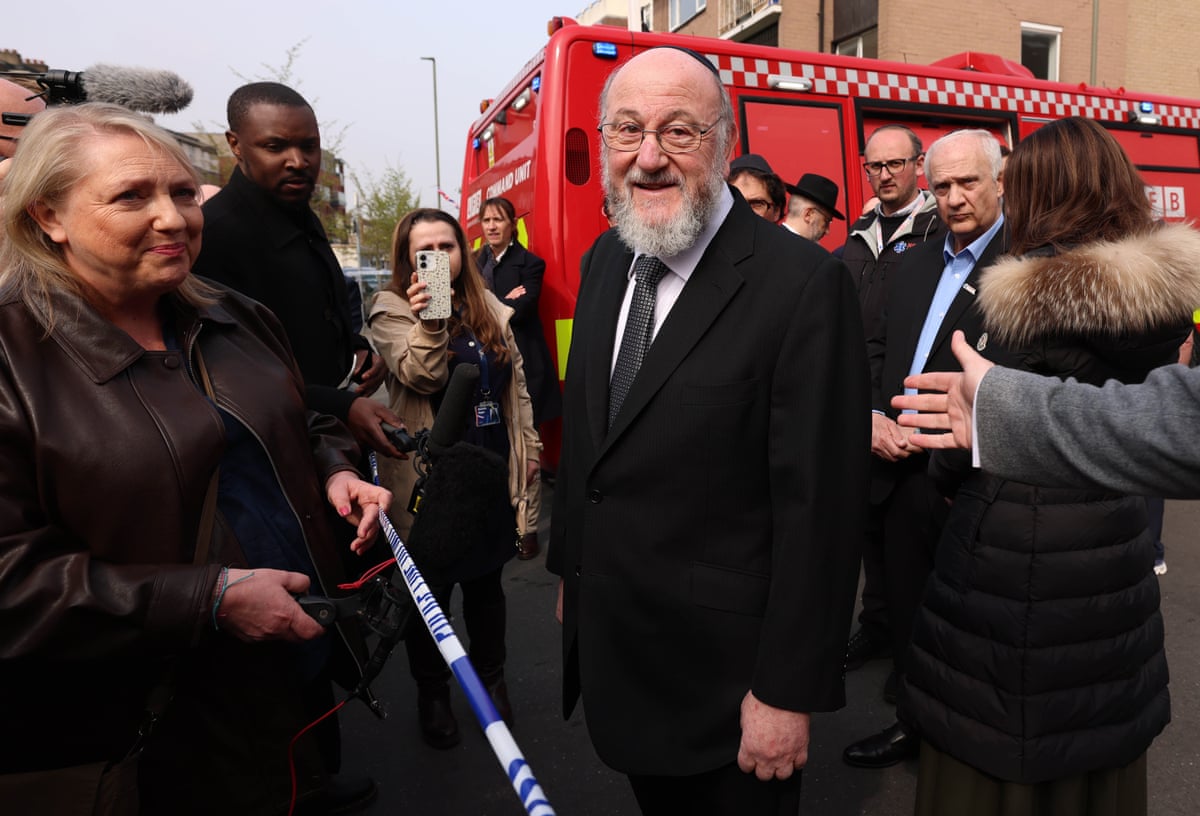 The Chief Rabi of the United Hebrew Congregations of the Commonwealth Ephraim Mirvis speaks to reporters at the scene of an arson attack on a Jewish ambulance service in London, Britain, 23 March 2026.