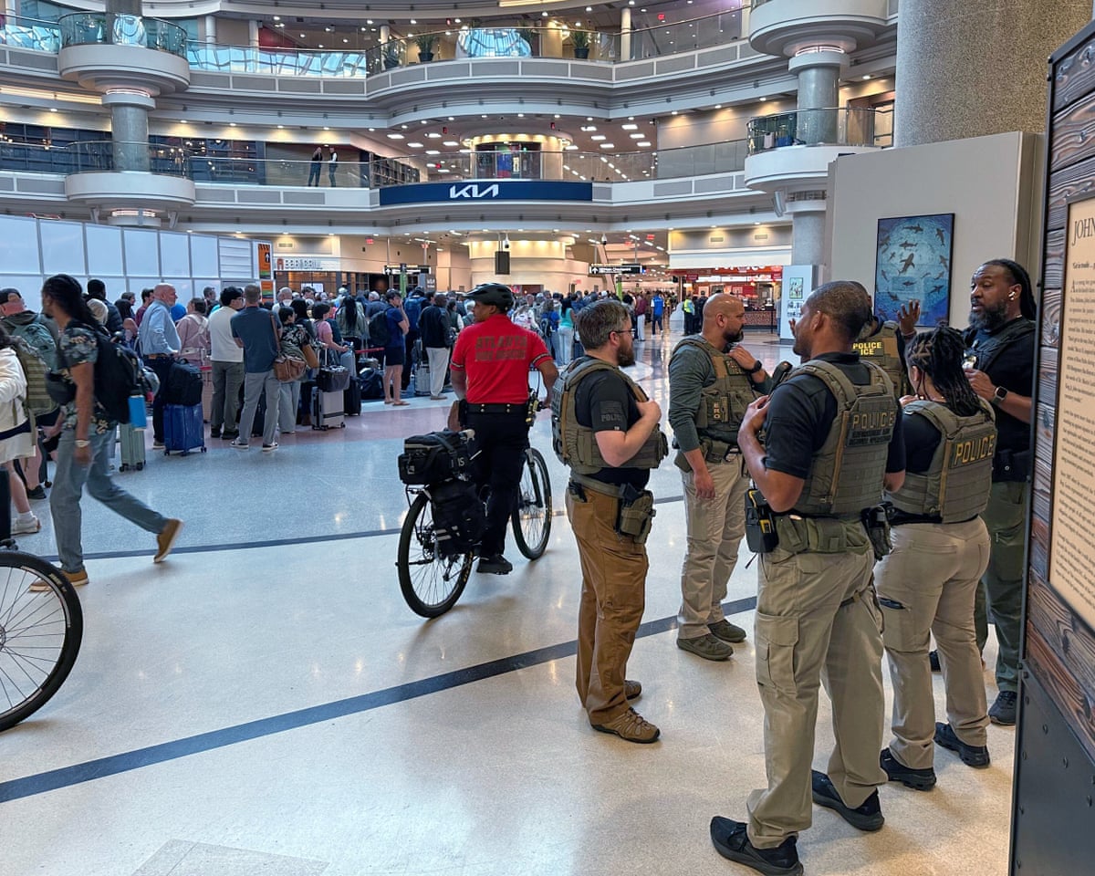 Federal immigration agents are seen at the Hartsfield-Jackson Atlanta Airport.