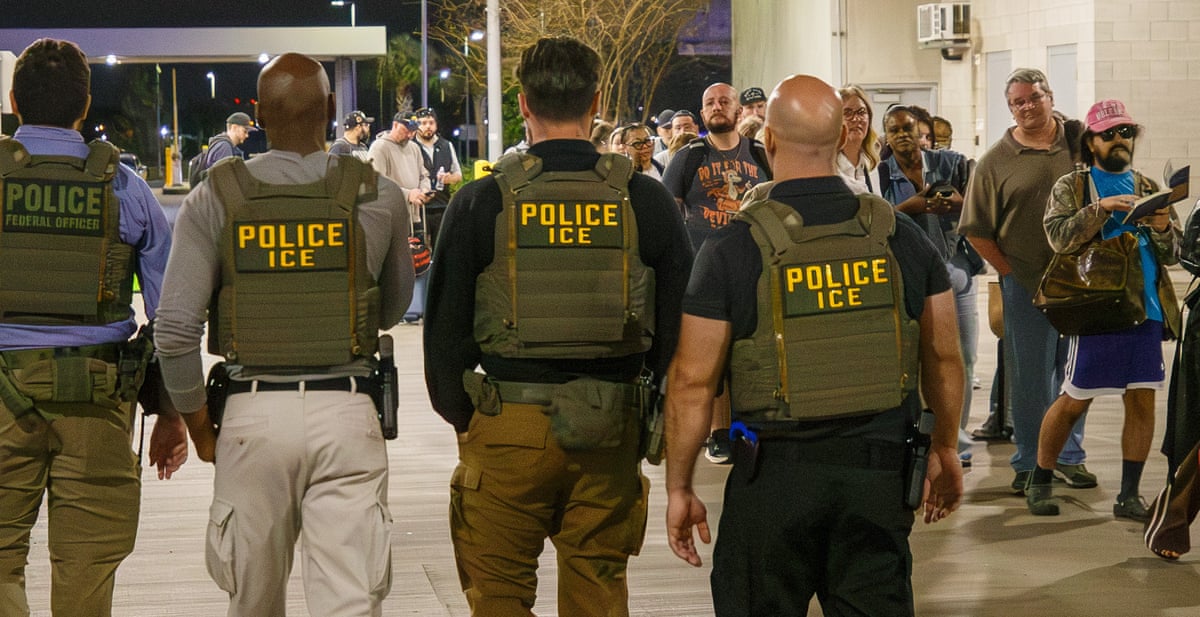 Immigration and Customs Enforcement (ICE) agents patrol Louis Armstrong international airport.