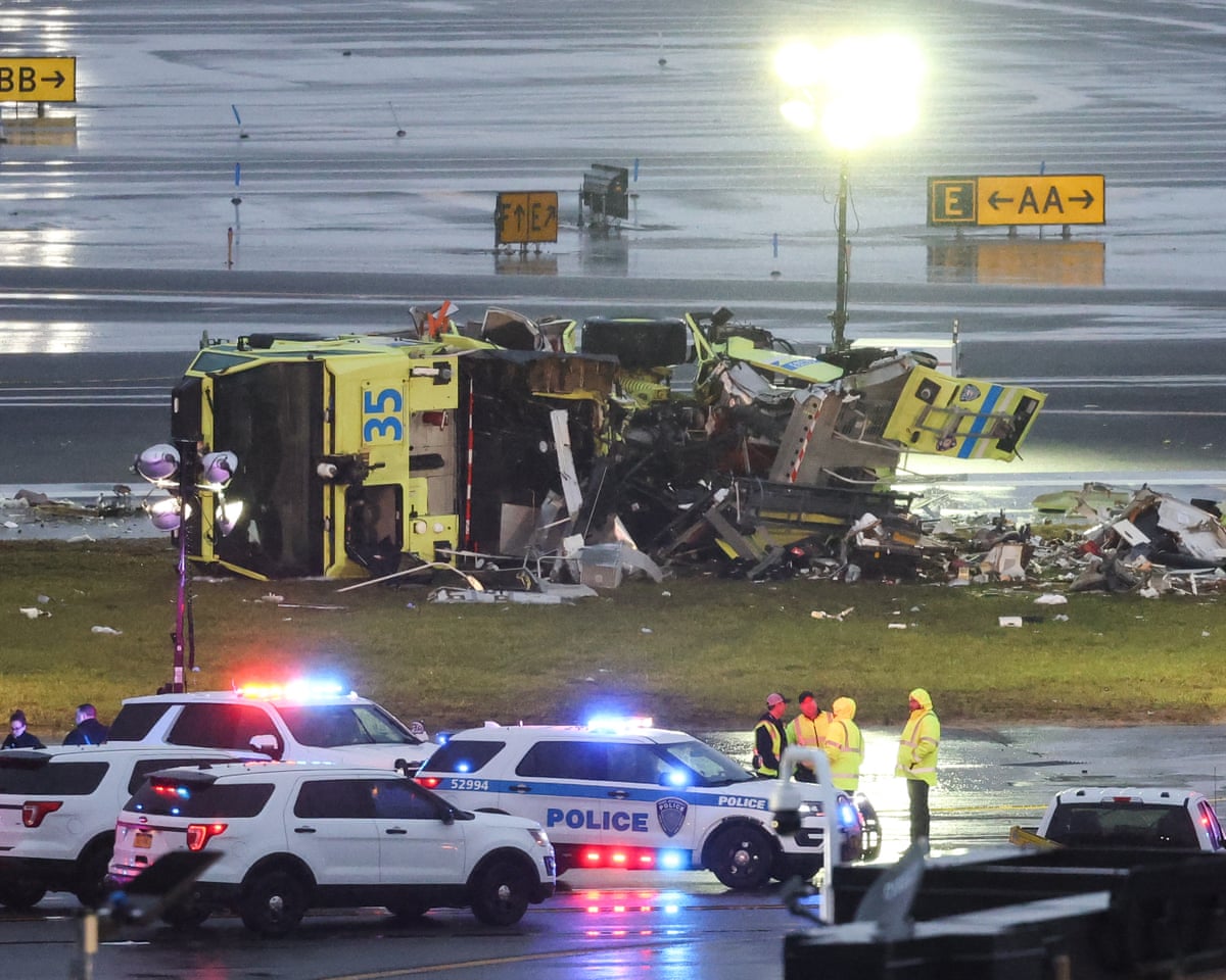 Port Authority fire truck sits near the runway after colliding with a plane.