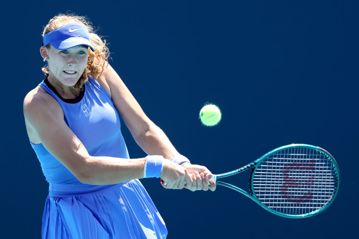 Mirra Andreeva returns a shot to Victoria Mboko at the Miami Open.