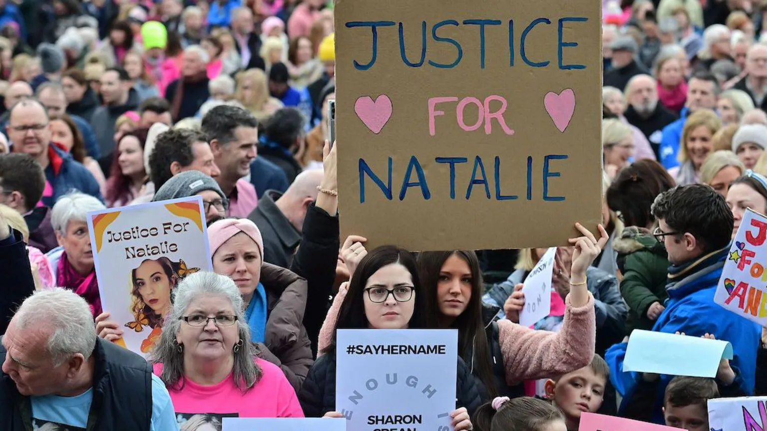 Pacemaker Press A wide shot of some of the hundreds of people who attended a public rally following the murder of Natalie McNally in Lurgan. Several young women at the front of the crowd are holding placards. Two of them read: 